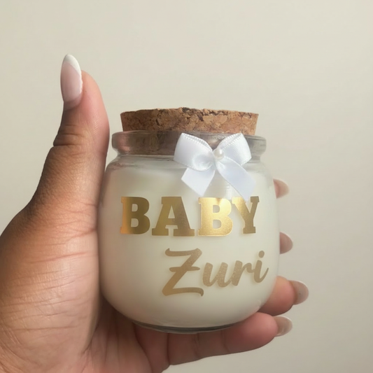 Baby Zuri candle in hand